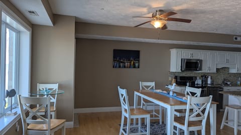 Total dining seats 8: 4- kitchen table, 2 - side table (shown) and 2- counter.