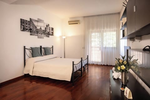 Family Room, Balcony, Garden View | Desk, soundproofing, iron/ironing board, free WiFi