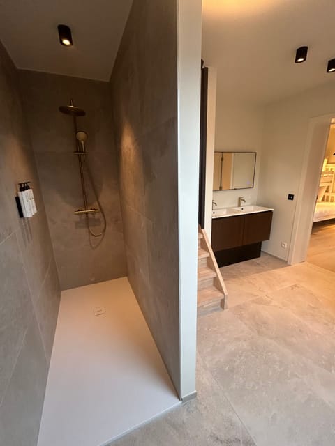 Family Room, 2 Bedrooms, Balcony | Bathroom | Shower, rainfall showerhead, hair dryer, heated floors