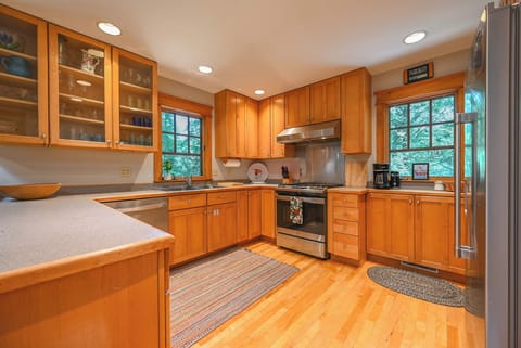 Kitchen with drip-style coffee maker, dishwasher, and gas range
