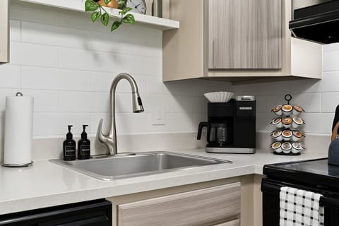 The kitchen includes all your basics: knives, spices, and utensils for hassle-free meal prep.