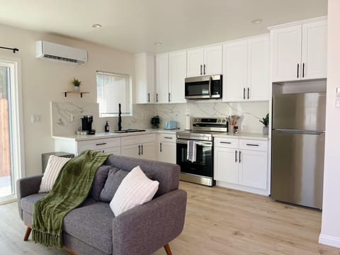 Couch and full kitchen. 