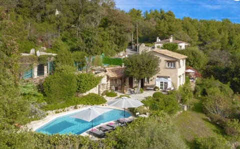 The house, and terrace and pool, all on the same level, set in extensive grounds