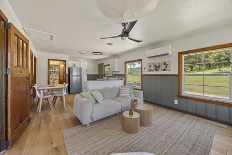 A cozy living area filled with natural light — perfect for relaxing after a day at the lake