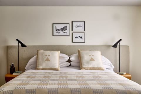 Sink into soft pillows and unwind with warm bedside lighting.
