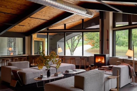 Unwind by the crackling fireplace in a designer great room.