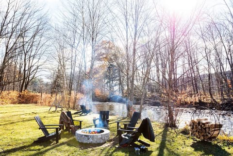 Relax by the riverside firepit under open, starry skies.
