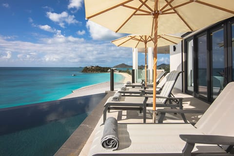 Soak up sunrise serenity beside your private infinity-edge pool.