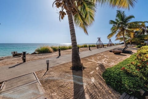 Stroll along the shoreline path with waves just steps away.