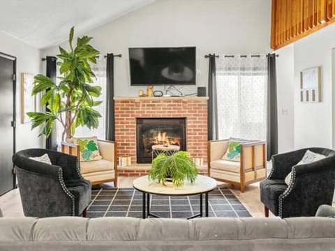 Cozy up beneath cathedral ceilings in a space made for laughter, lounging, and late-night fireside chats