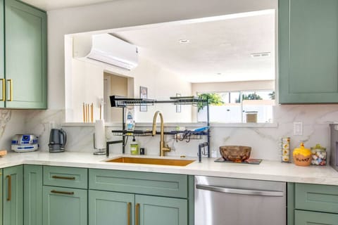 Fully stocked kitchen with stainless steel appliances and plenty of natural light.