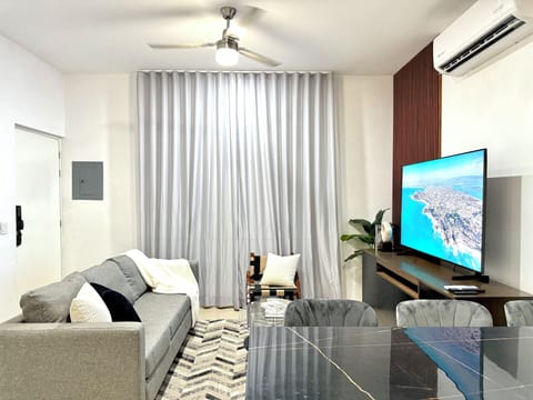 Deluxe Double Room | Living room | 65-inch LED TV with cable channels