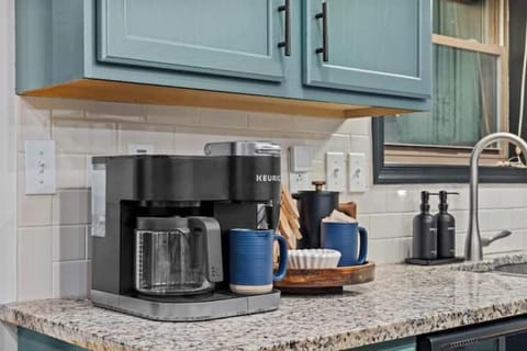 Coffee bar with Keurig, mugs, and all the essentials for your morning brew.