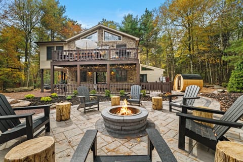 Beautiful outdoor fire pit surrounded by Adirondack seating, 