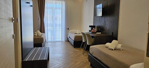 Deluxe Quadruple Room | Hypo-allergenic bedding, pillowtop beds, desk, laptop workspace