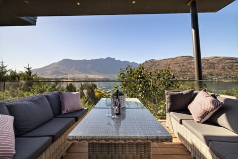 Outdoor dining with lake and alpine backdrop