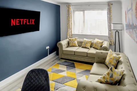 Bright lounge with two sofas and smart TV