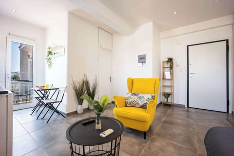 Bright modern lounge with vibrant seating, perfect for relaxing above the city’s lively energy.