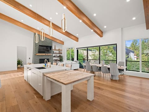 [Top Floor] Our incredible entertaining space complete with a dining table that seats 9, bar that seats 4, butcher block, living room, and full kitchen. Perfect for any gathering!*Foldable tables available for extra seating!