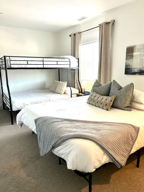 King size bed with queen bunk and full on top