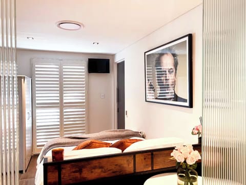Immaculate room with ergonomic massage bed, heated floors and storage.