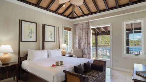 Linger in bed with harbor views and morning coffee tray.