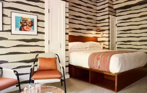 Recharge in a playful, patterned room with roomy king bed.