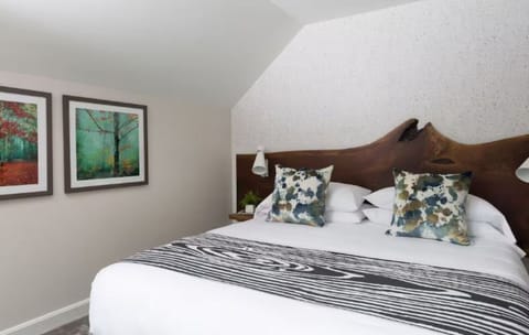 Drift off under vaulted ceilings in a calm, cozy retreat.