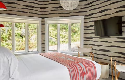 Wake up to sunlit windows and relax with evening TV.
