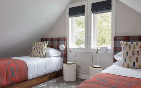 Wake to soft daylight in bright twin beds for friends.