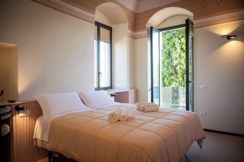 Deluxe Double or Twin Room, 1 Bedroom, Balcony, Courtyard View | Minibar, in-room safe, individually decorated, individually furnished