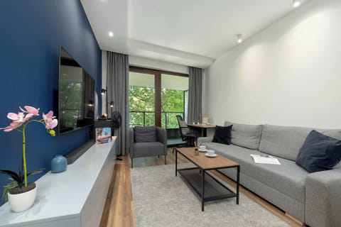 Relax in the stylish living room with a comfortable sofa and modern decor.
