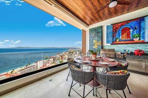 Unwind on the private terrace overlooking the bay and city skyline.