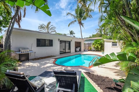 Another view of the private pool, surrounded by lush greenery for a serene and inviting backyard escape.