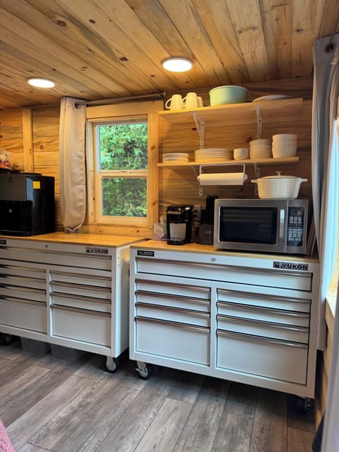 Enjoy the amenities: microwave, Keurig coffee maker, water dispenser, fridge