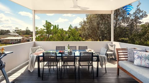 The Art House | Covered outdoor balcony | Outdoor dining | Ceiling fan