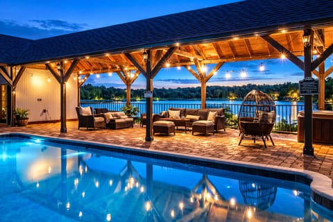 Unwind poolside under glowing lights and lake views, perfect for sunset swims and night chats.