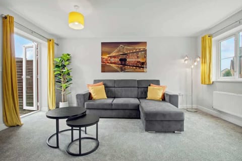 Living Room: Bright and spacious living area with a comfortable sofa and plenty of natural light.