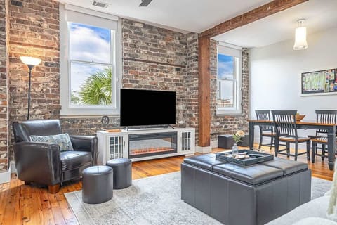 Enjoy striking original brick and beams alongside the stunning city skyline view of the iconic Talmadge Bridge!