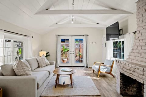 Sunny and airy living room with queen sleeper sofa