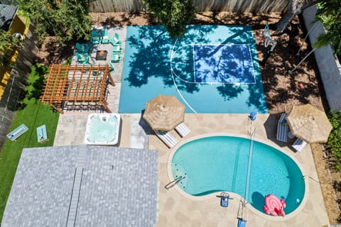 A bird’s-eye view of paradise! From the private pool and basketball court to the firepit, hot tub, and outdoor dining—your ultimate backyard escape awaits.