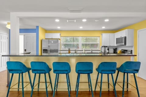 Our fully stocked kitchen features a spacious island with high seating—perfect for casual meals, morning coffee, or chatting with the chef.