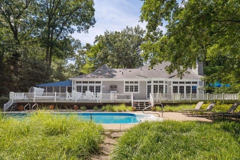 Spacious deck overlooks the pool and private backyard
