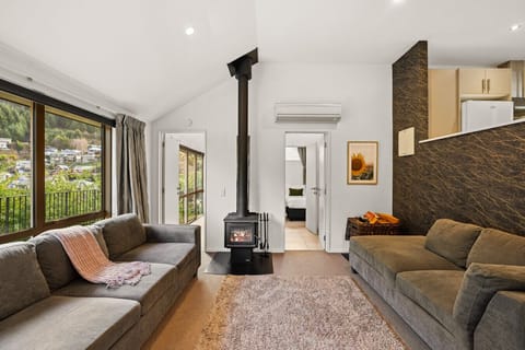 Living area: Comfortable lounge with log burner and efficient heat pump.