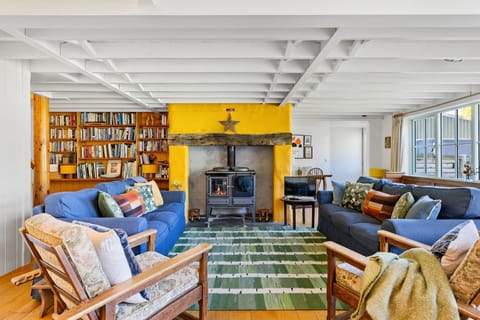 Living area with wood burning stove - Master Shipwrights House