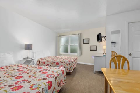 Two double beds with a kitchenette