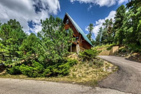 Admire the charming facade of the cabin, where rustic charm meets modern comfort — the perfect introduction to your peaceful getaway!