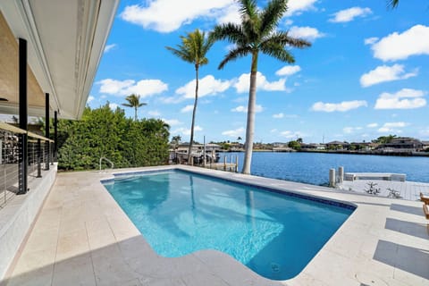 Enjoy the gorgeous view at the pool under the palm trees!
