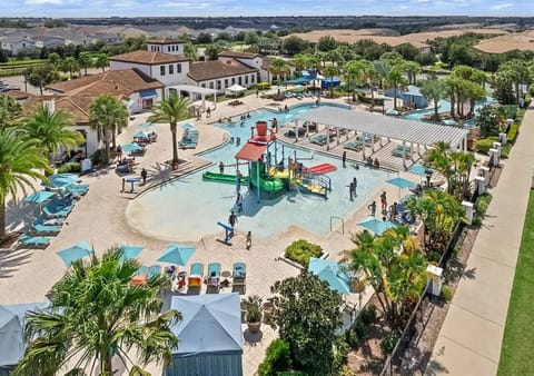 Kid-friendly water play area with plenty of seating for parents to relax