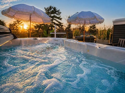 Soak in sunset views from your private rooftop hot tub—pure relaxation, elevated 🌅🛁
